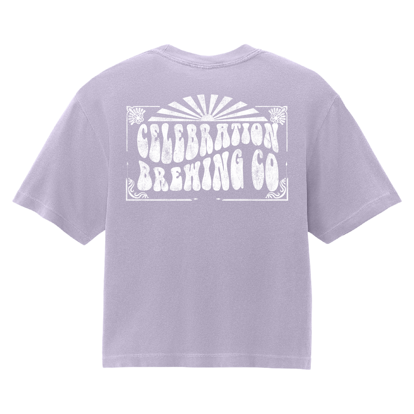 A light lavender purple short-sleeve t-shirt shown from the back, featuring a large white distressed graphic that reads 'CELEBRATION BREWING CO' with a sunburst design above it.